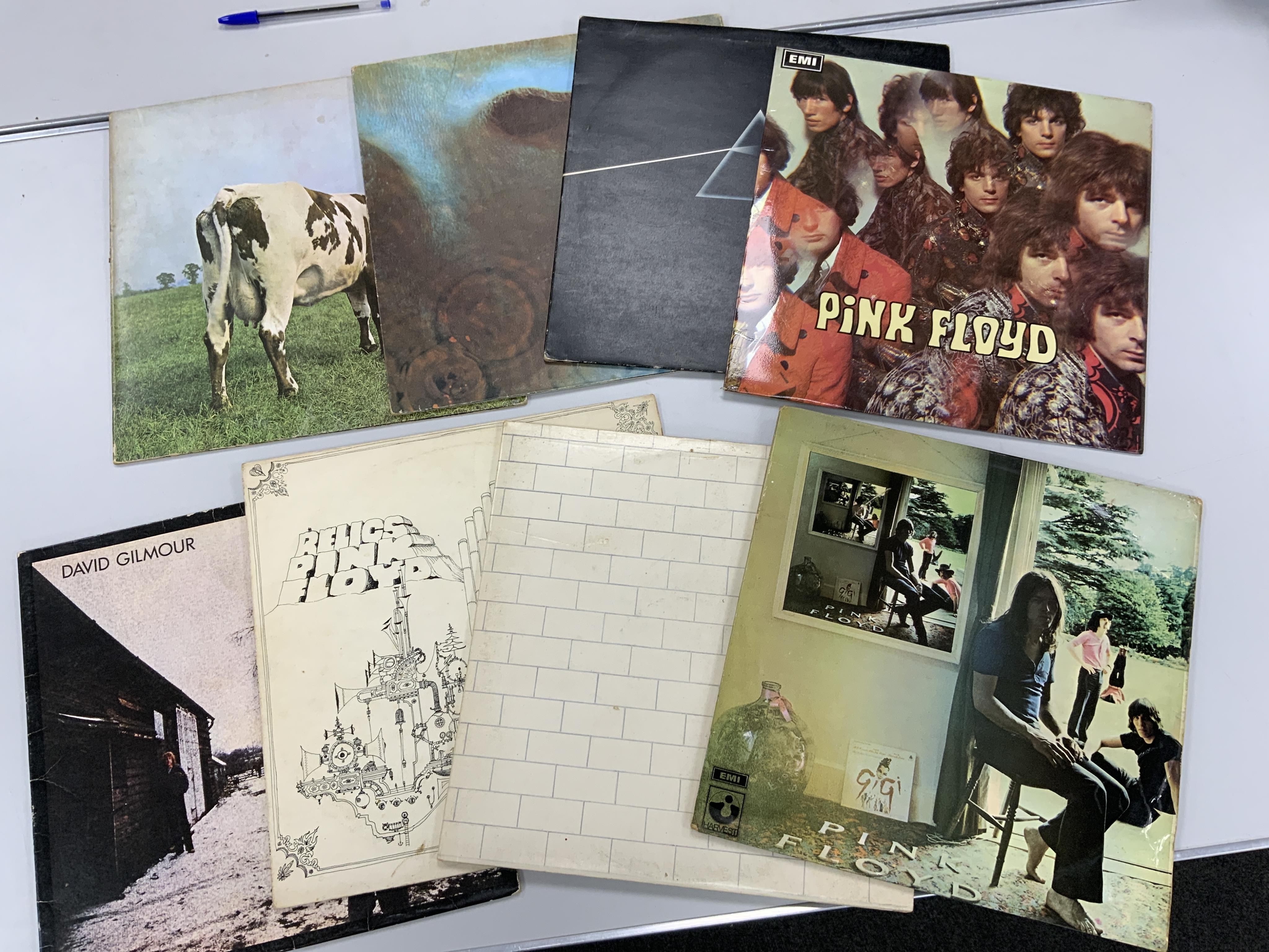 Eight Pink Floyd, etc. LP record albums, including; The Piper at the Gates of Dawn, Dark Side of the Moon, Meddle, Atom Heart Mother, Ummagumma, The Wall, Relics, and David Gilmour. Condition - fair